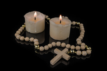 Image With Cross, Bible and Canndles,Rosary with crucifix lying on black
