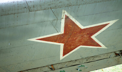Identification mark of the Air Force of the Russian Federation, a five-pointed red star, bordered by a white stripe on an old Soviet passenger or military transport aircraft from the Second World War.
