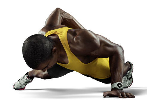 Young athletic man doing push-ups on transparent background. Muscular and strong guy exercising.	