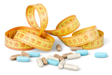 Capsules and yellow measuring tape  on white background