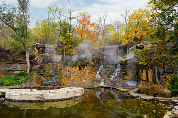 Autumn colors in the National Dendrology Park of Sofiyivka, Uman, Ukraine. Waterfall in the park.