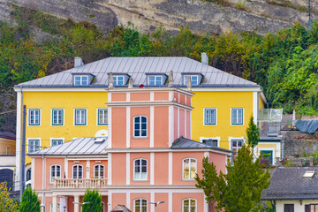 Colorful houses on the Embankment of the Salzach River, urban landscape, old architectural historical buildings; Austria, Salzburg, 