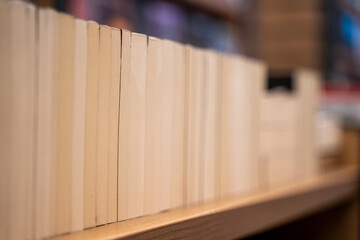 Pages of Books Arranged on Shelf in Bookstore