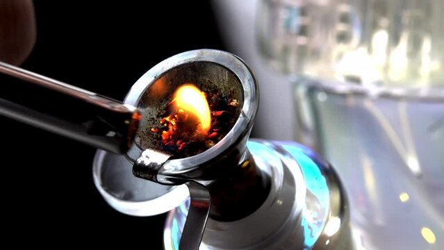 Macro close up smoking medical marijuana bud with bong. Accessories for smoke weed