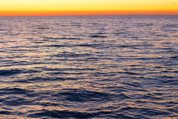sea at sunset.  surface of  sea in  evening. Water close-up. Dark waves.