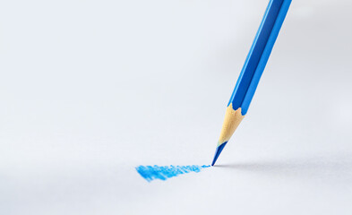 Blue pencil on a white background