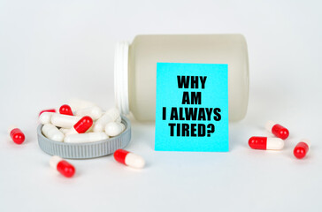 On a gray background, a jar, capsules and a sign with the inscription - Why am i always tired
