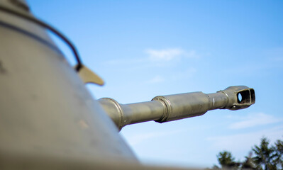 Tower of an armored personnel carrier or tank. Heavy weapons of war, sky background. Army equipment for combat and defense. Cannon tower. Details of military equipment. Close-up.