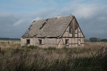 abandoned farm house in rural landscape