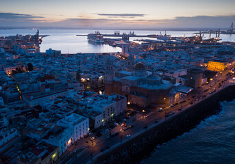 Panoramic view from drone of night spanish city of Cadiz