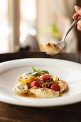 Stylish serving of food in the restaurant. Serving. Waiter