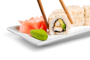 Tasty Sushi rolls on plate on  background