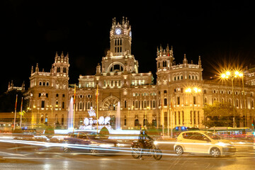Fototapeta na wymiar The Cibeles Palace at night in the city of Madrid, Spain