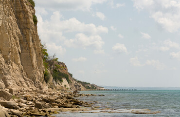 Fototapeta na wymiar Bulgarian resort-Balchik. Rocky cliffs of sedimentary rock on the Black Sea coast.