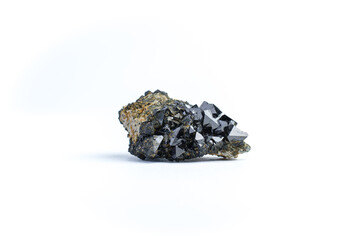 Magnetite (natural magnet, iron ore) macro detail white isolated background. close-up Rough raw...