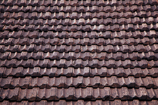 Old brown roof tiles background.