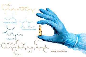 a hand in a blue medical glove holds an ampoule with liquid. Peeling acid, botox, hyaluronic acid,...
