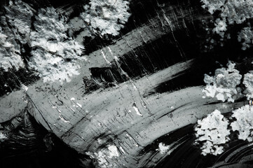 Fototapeta premium snowflake obsidian (white cristobalite crystals) obsidian macro detail texture background. close-up raw rough unpolished semi-precious gemstone