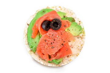 Rice Cake Sandwich with Fresh Salmon, Avocado and Olives - Isolated on White. Easy Breakfast. Diet Food. Quick and Healthy Sandwiches. Crispbread with Tasty Filling. Healthy Dietary Snack - Isolation