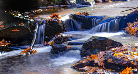 water cascading  in stream at wendell state forest,