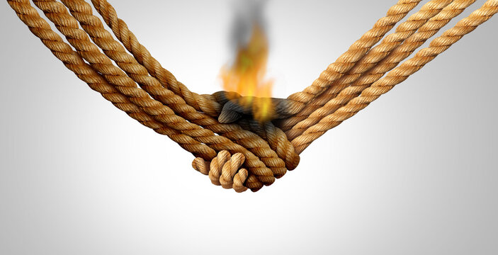 Agreement failure and Business deal fail concept as two hands made of rope in a handshake on fire as a relationship or business crisis and breaking a friendship