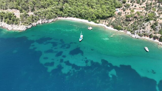 Scenic aerial shot of a coastline with rocky cliffs and clear seawater in Dalyan Turkey