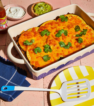 Enchilada Casserole On Pink Surface