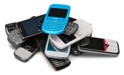 Pile of old smartphones isolated on white background
