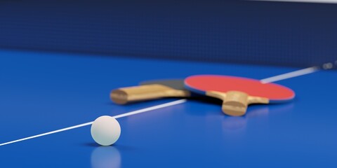 Table tennis or ping pong paddles or rackets with table tennis ball on blue table background, selective focus