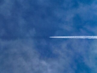 airplane in the sky. shadow from the plane