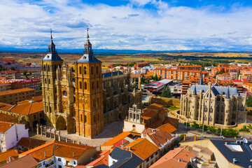 View from drone of residential area of Spanish city of Astorga overlooking medieval Gothic Cathedral and Episcopal Palace..