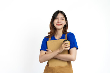 Cheerful young pretty asian woman blue t-shirt and apron coffee owner isolated on white background. Holding paper coffee up and clipboard