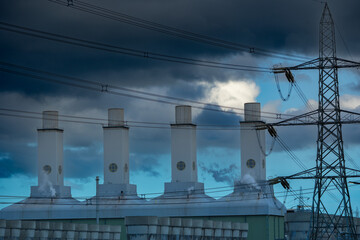 Industrial power station with storm clouds