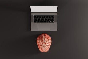 Brain lying in front of the computer on a dark background. Concept of connecting brain to computer, awareness. 3d render.