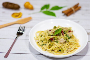 For brunch flat pasta topped with curry sauce and vegetables.