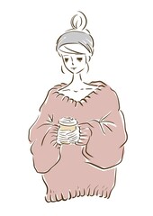 Woman in a large knit enjoying a latte.