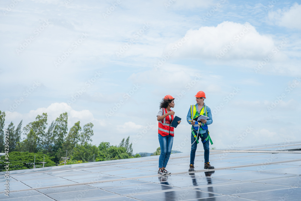 Aufkleber engineer with technician working and maintenance with solar batteries near solar panels at sunny day