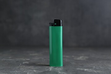 Stylish small pocket lighter on grey table