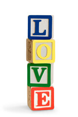 Toy wooden blocks stack with word love , tower of blank multicolor box cubes over white background