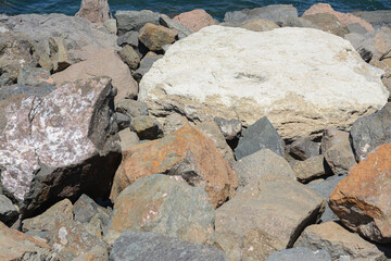 Rocky beach on sunny day, closeup view