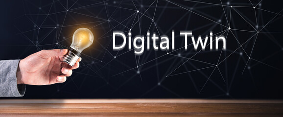 Digital Twin and light bulb in hand