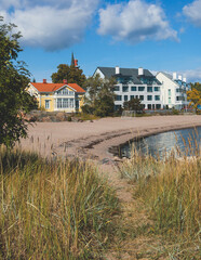 View of Hanko town coast, Hango, Finland, with beach and coastal waterfront, wooden houses and beach changing cabins, Uusimaa, Hanko Peninsula, Raseborg sub-region, summer sunny day