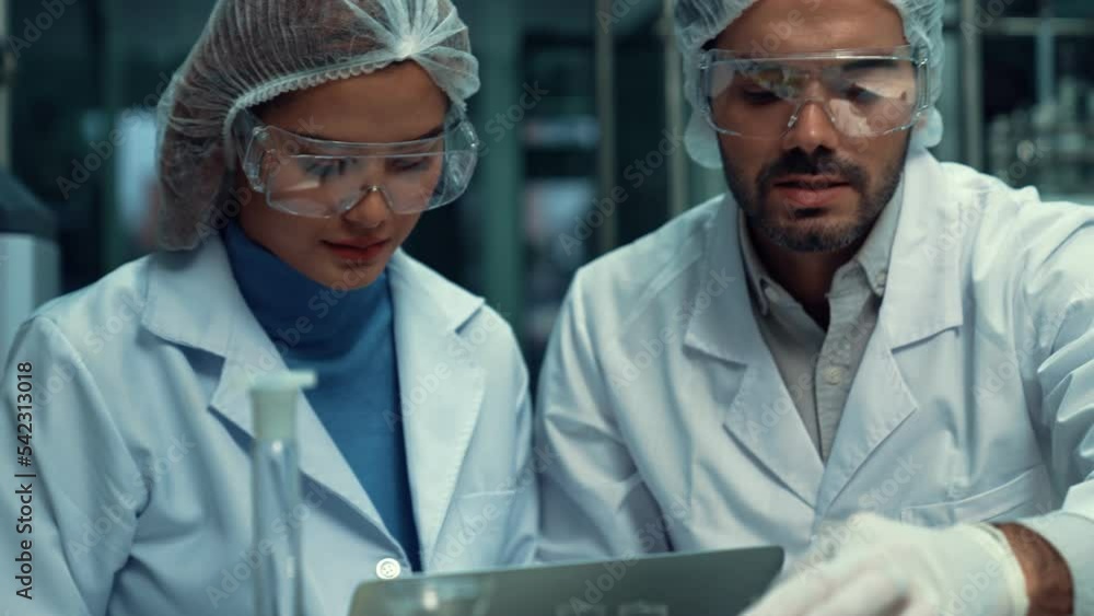 Poster two scientist in professional uniform working in curative laboratory for chemical and biomedical exp