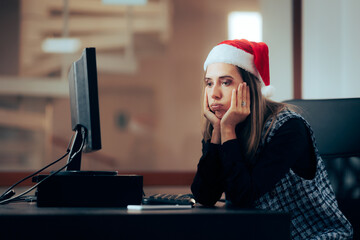 Unhappy Office Employee Working on Christmas Eve. Stressed entrepreneur spending time overworking...