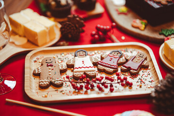 Christmas gingerbread cookies with Christmas decorations on table