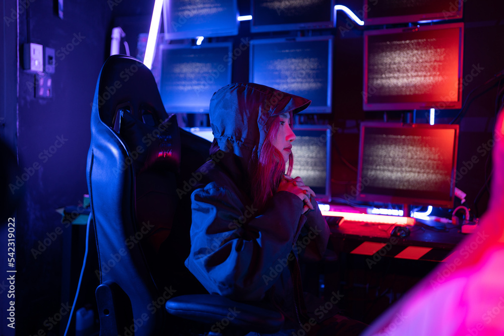 Fototapete Hack program concept. Professional woman hacker using keyboard send coding bad data and error into software computer online system and spreading to global stolen personal information.