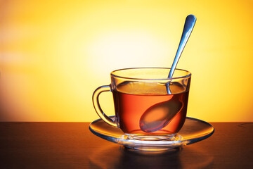 Cup of tea on dark wooden table.