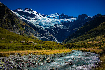 New Zealand, Earnslaw Burn Track takes you through the bush to a tussock-covered valley with jaw-dropping views of the glacier and waterfalls on Mt Earnslaw. This spot is truly New Zealand's best-kept