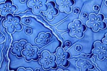 Antique plum flower painted indigo color platter texture.