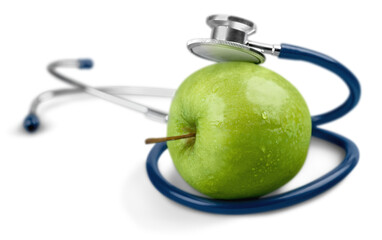 A Stethoscope and a Green Apple
